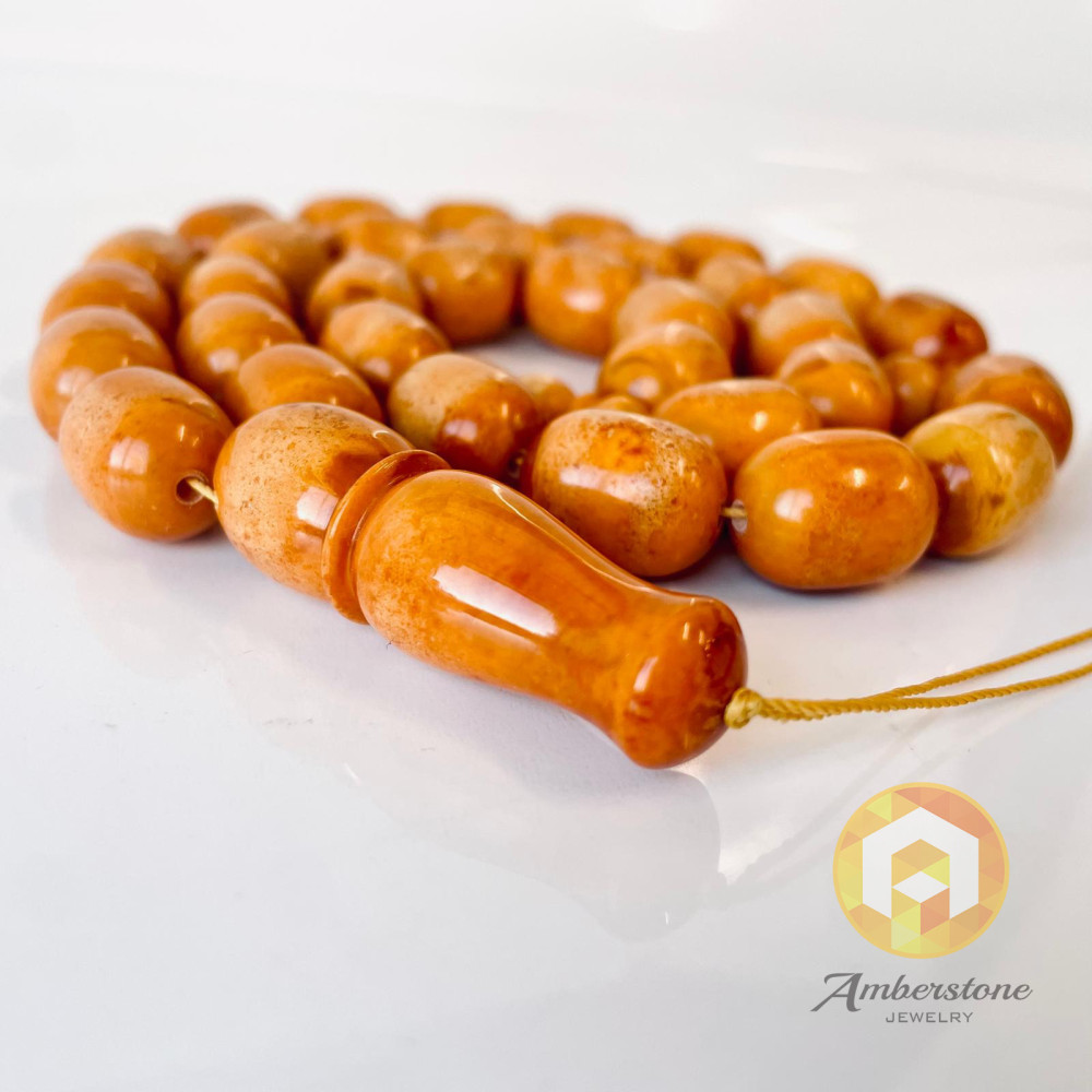 Discover timeless elegance: Vintage Natural Pressed German Amber Islamic Prayer Beads 82 grams