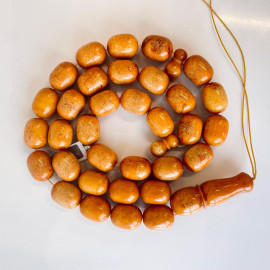 Discover timeless elegance: Vintage Natural Pressed German Amber Islamic Prayer Beads 82 grams