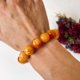 سوار بوهو شيك عنبر وردي-برتقالي: مجوهرات مصنوعة يدوياً فريدة من نوعها مع العنبر الطبيعي