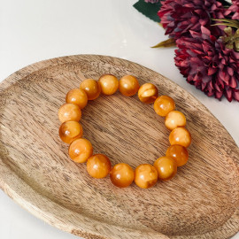 سوار بوهو شيك عنبر وردي-برتقالي: مجوهرات مصنوعة يدوياً فريدة من نوعها مع العنبر الطبيعي