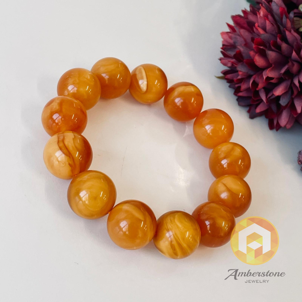 سوار بوهو شيك عنبر وردي-برتقالي: مجوهرات مصنوعة يدوياً فريدة من نوعها مع العنبر الطبيعي