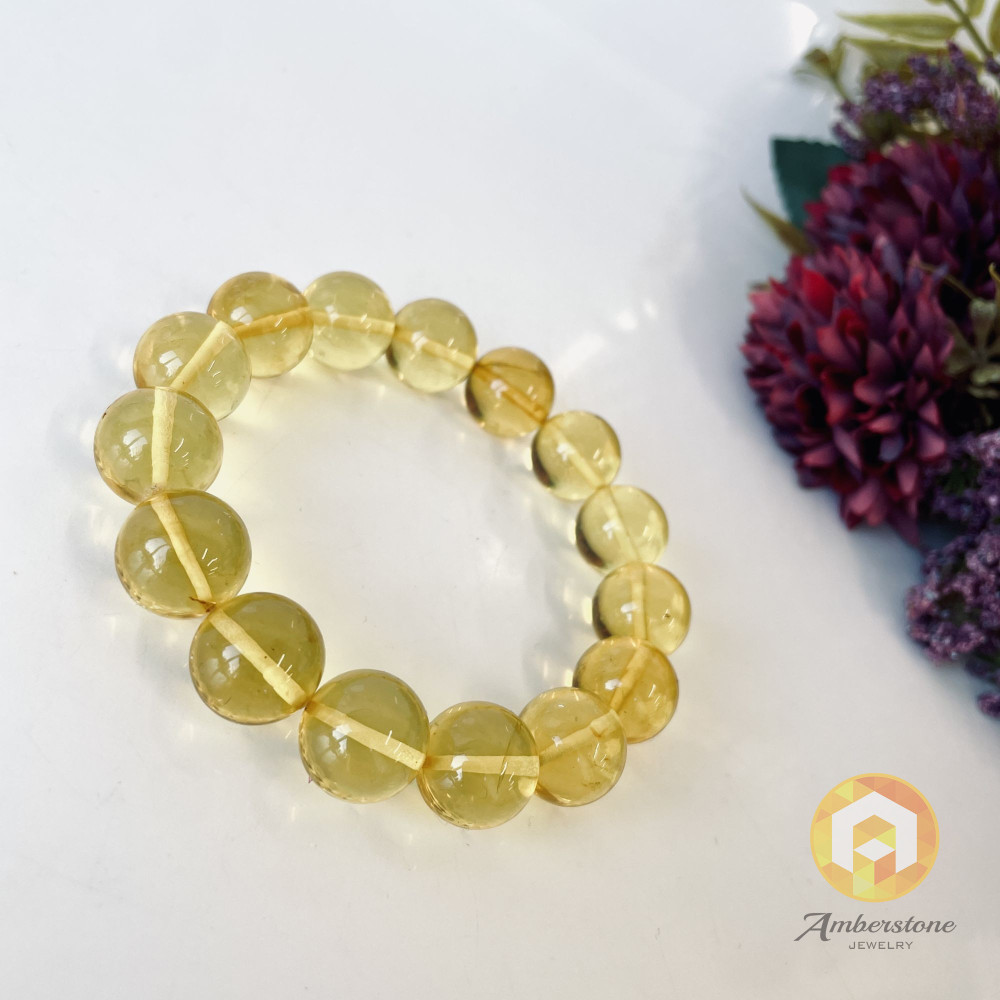 سوار بوهو شيك عنبر وردي-برتقالي: مجوهرات مصنوعة يدوياً فريدة من نوعها مع العنبر الطبيعي