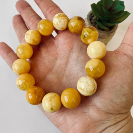 سوار بوهو شيك عنبر وردي-برتقالي: مجوهرات مصنوعة يدوياً فريدة من نوعها مع العنبر الطبيعي